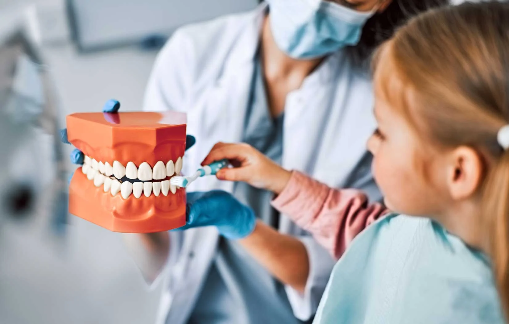 Dentist explaining dental sealants to patient in Brentwood, Los Angeles, CA